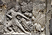 Prambanan - Ramayana reliefs of Shiva Temple. Panels of Rama threatens a bird who stole offerings. 